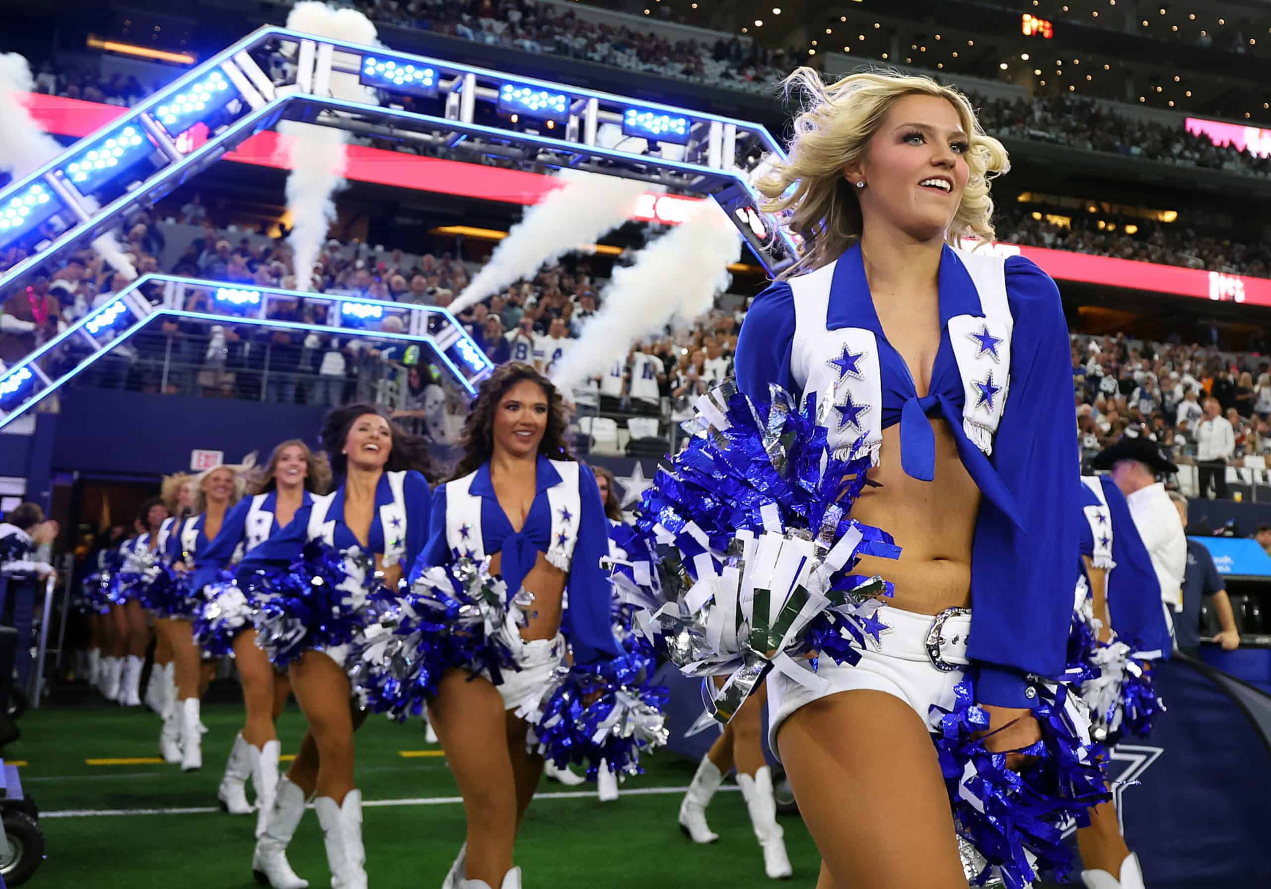 ARLINGTON, TEXAS - OCTOBER 29: The Dallas Cowboys Cheerleaders enter the stadium before the game against the Los Angeles Rams at AT&T Stadium on October 29, 2023 in Arlington, Texas.